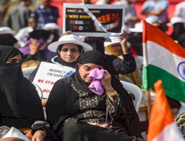 A woman gets emotional during a protest against CAA and NRC